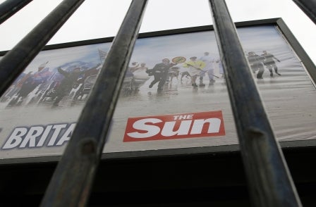 Police officer charged with selling information to The Sun